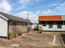 An outdoor area with buildings and plants at The Milk Shed in Plymtree