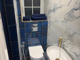A bathroom with a toilet and a sink at the property