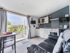 A kitchen with a seating area at The Nook in Praa Sands