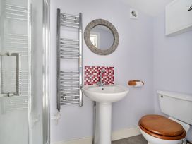 A bathroom with a sink and toilet at The Nook in Praa Sands