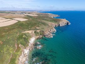 An aerial view of a coastal landscape with cliffs at The Nook Praa Sands