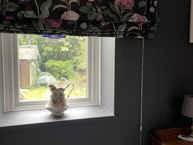 A window with a vase on the sill at High Dyke Cottage