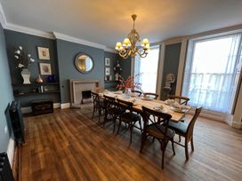 A dining room with a table set at ASH HOUSE Wincanton