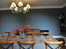 A dining room with a table and chairs at ASH HOUSE in Wincanton