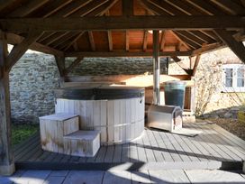 An outdoor area with a hot tub and steps at ASH HOUSE Wincanton
