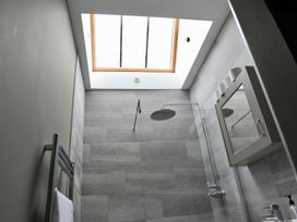 A bathroom with a shower and a window at ASH HOUSE in Wincanton