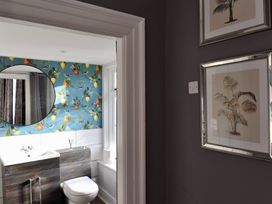 A bathroom featuring a toilet and wash basin at ASH HOUSE Wincanton