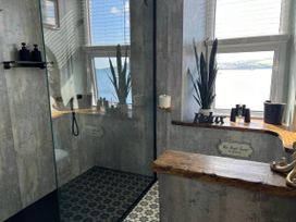 A bathroom with a shower and bathtub at The Best Seat in the House