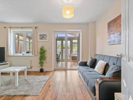 A living room with a sofa and coffee table at The Old Barn in Manchester