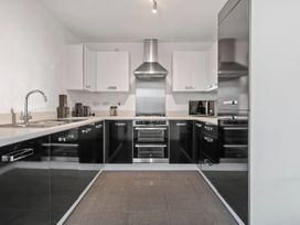 A kitchen with cabinets and appliances at the property