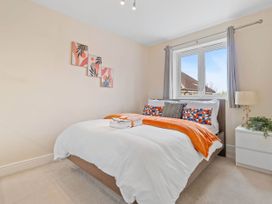 A bedroom with a bed and window at The Old Barn in Manchester