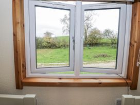 A window with a view of greenery at Willow Lodge in Admaston near Abbots Bromley