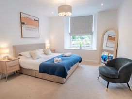 A bedroom with a bed and a window at Derwent in Ulverston