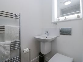 A bathroom with a sink, toilet and towel rail at Derwent in Ulverston