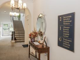 A hallway with a table and a signboard at Derwent in Ulverston