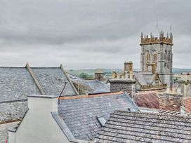 A view of rooftops and a church tower at 