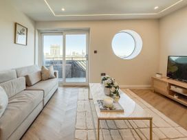 A living room with a sofa and coffee table at the property location