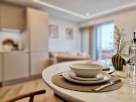 A table set with plates and cutlery in a kitchen at 