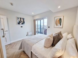 A bedroom with a bed and door at the property in an unspecified location