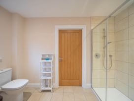 A bathroom with a shower and a toilet at The Old Barn in Manchester