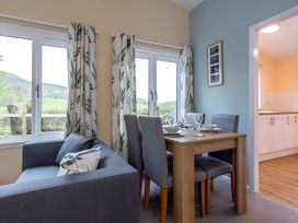A dining room with a table and chairs at the property in an unspecified location