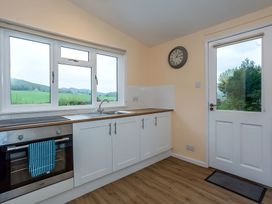 A kitchen with an oven and sink at the property in the location