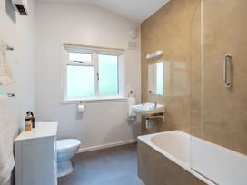 A bathroom with a toilet, sink, and bathtub at the property