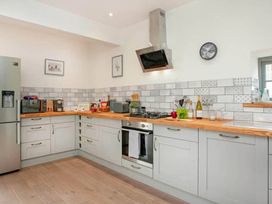 A kitchen with appliances and wooden countertops at the property
