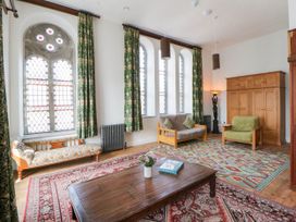 A living room with a sofa and coffee table at Capel Llani in Llanidloes