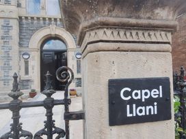 An entrance with a sign at Capel Llani in Llanidloes