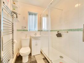 A bathroom with a shower and sink at Ivy Corner in Bridlington