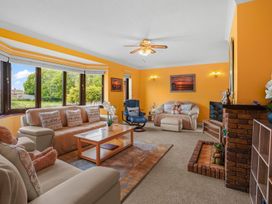 A living room with furniture and a fireplace at the property in unspecified location
