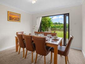 A dining room with a table set for a meal at The Old Barn in Manchester