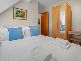 A bedroom with a bed and wardrobe at the property in the location