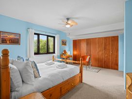 A bedroom with a bed and window at The Old Barn in Manchester