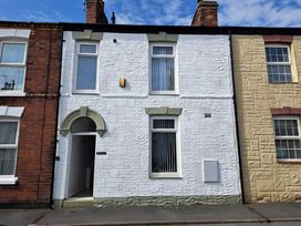 A house facade with entrance and windows at Fisherman's Cottage in 