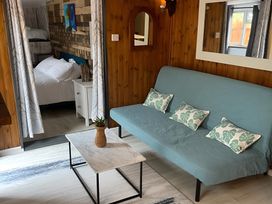 A living room with a sofa and coffee table at Little Russets