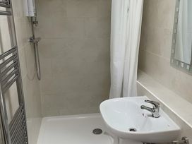 A bathroom with a shower and sink at Little Russets