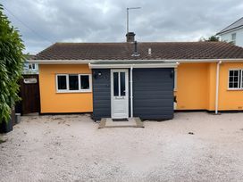 A house with a front door and windows at Little Russets in 