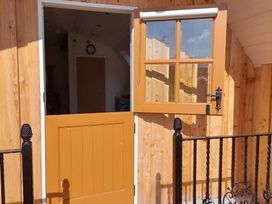 An entrance door with a clock visible at the property in 