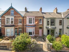 A row of houses with front gardens at Victorian Beach House in Saltburn-By-The-Sea