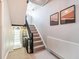A hallway with stairs leading up at Victorian Beach House Saltburn-By-The-Sea