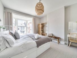 A bedroom with a bed and desk at Victorian Beach House in Saltburn-By-The-Sea