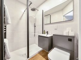 A bathroom with a shower, sink, and toilet at Victorian Beach House in Saltburn-By-The-Sea