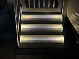A set of illuminated outdoor stairs at Pine 48