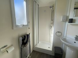 A bathroom with a shower and sink at 214 Oaklands Area