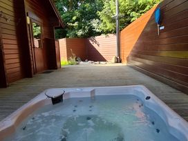 A hot tub in an outdoor area at Gisburn Forest Lodge