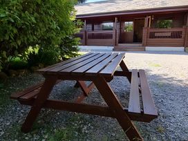 A picnic table in an outdoor area at Gisburn Forest Lodge