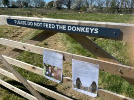 A sign on a gate in a field at Y Nyth