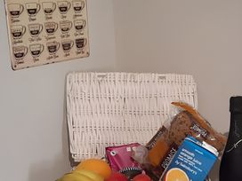 A kitchen with fruits and groceries on a table at Lil Nauti